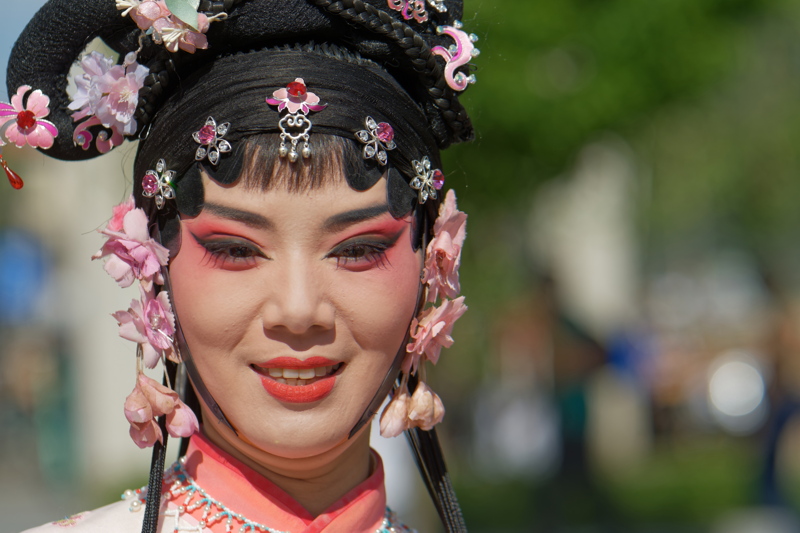 Face of a  woman in traditional Chinese theatre makeup and costume